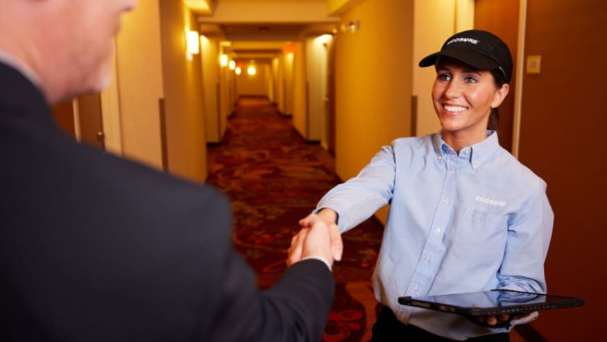 Ecosure representative with customer at a hotel