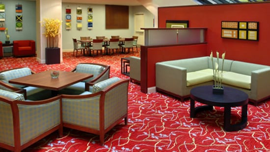 Clean and vibrant carpets of a busy hotel lobby after receiving commercial carpet cleaning products.
